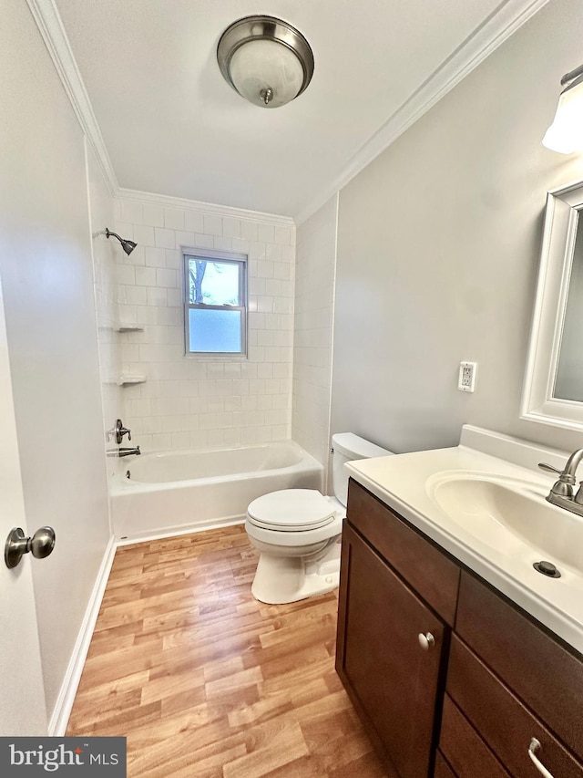 full bathroom with toilet, wood finished floors,  shower combination, and ornamental molding