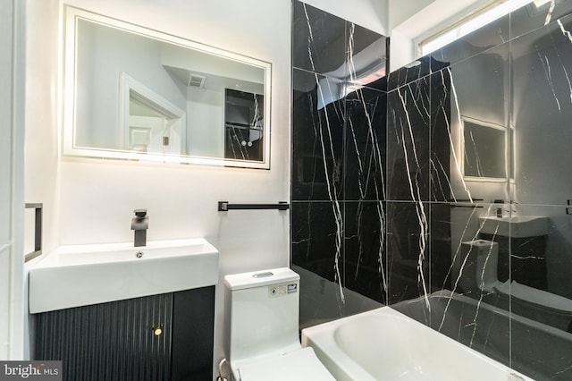 bathroom with vanity and toilet