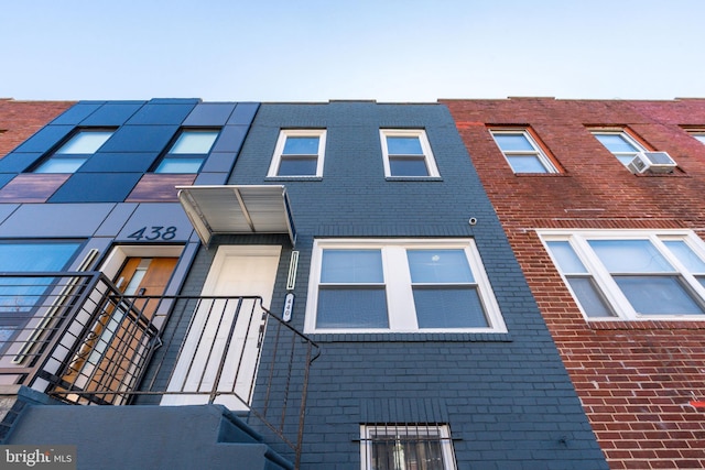 townhome / multi-family property featuring brick siding