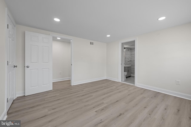 unfurnished bedroom featuring recessed lighting, baseboards, and light wood finished floors