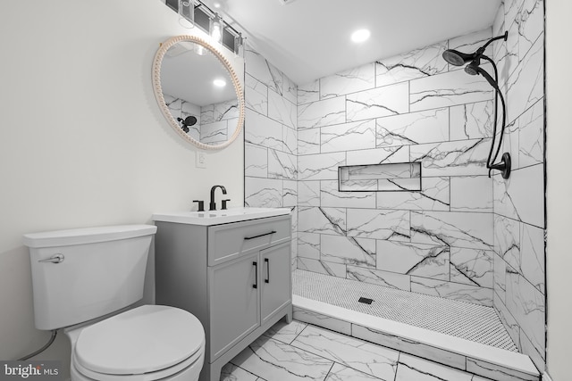 full bathroom featuring vanity, tiled shower, recessed lighting, toilet, and marble finish floor