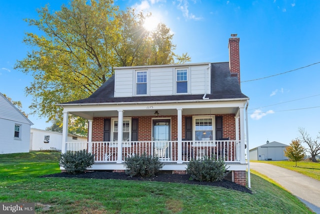 1175 Letort Rd, Conestoga, PA 17516 - view of front of property featuring brick siding, a porch, and a front yard