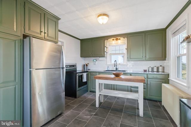 1175 Letort Rd, Conestoga, PA 17516 - kitchen with green cabinetry, appliances with stainless steel finishes, a sink, and radiator heating unit