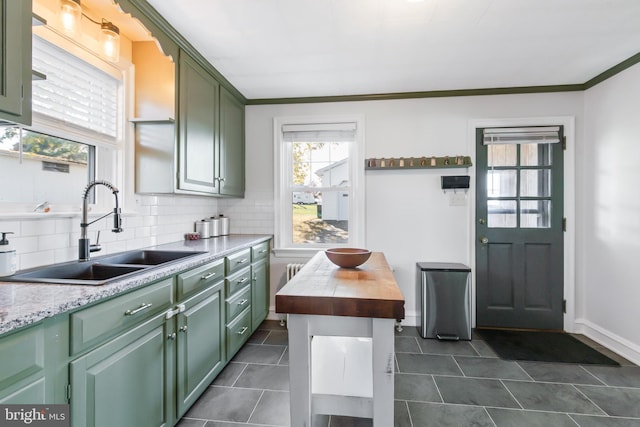 1175 Letort Rd, Conestoga, PA 17516 - kitchen featuring green cabinets, a sink, tasteful backsplash, dark tile patterned flooring, and crown molding