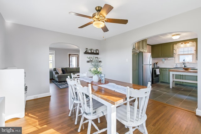1175 Letort Rd, Conestoga, PA 17516 - dining space with arched walkways, wood finished floors, plenty of natural light, and ceiling fan