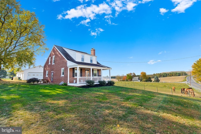 1175 Letort Rd, Conestoga, PA 17516 - view of side of home featuring covered porch, brick siding, and a chimney