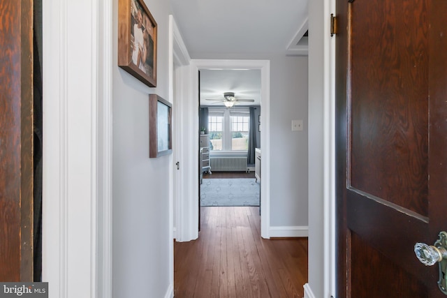1175 Letort Rd, Conestoga, PA 17516 - hallway with radiator heating unit, baseboards, and dark wood-type flooring