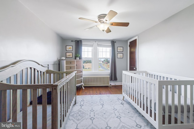 1175 Letort Rd, Conestoga, PA 17516 - bedroom with radiator, wood finished floors, and a ceiling fan