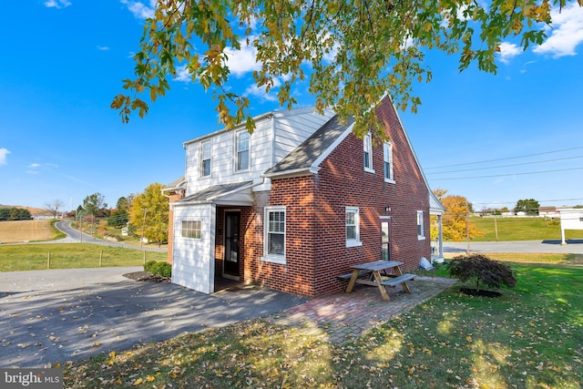 1175 Letort Rd, Conestoga, PA 17516 - view of side of property featuring a lawn and brick siding