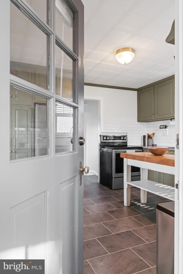1175 Letort Rd, Conestoga, PA 17516 - kitchen with stainless steel range with electric cooktop, tasteful backsplash, dark tile patterned flooring, and butcher block countertops