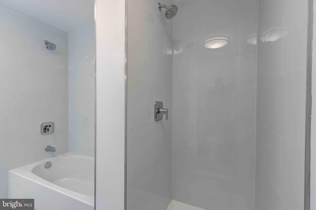 bathroom featuring a shower and a bathtub