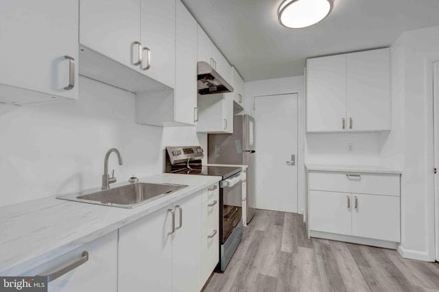 kitchen featuring a sink, white cabinets, electric stove, under cabinet range hood, and light wood-type flooring