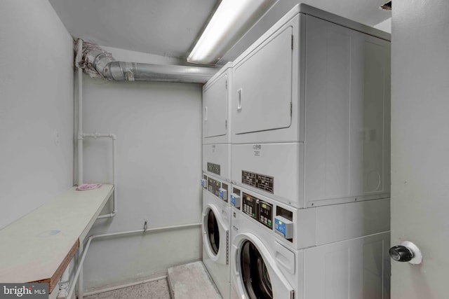 common laundry area featuring stacked washer and dryer