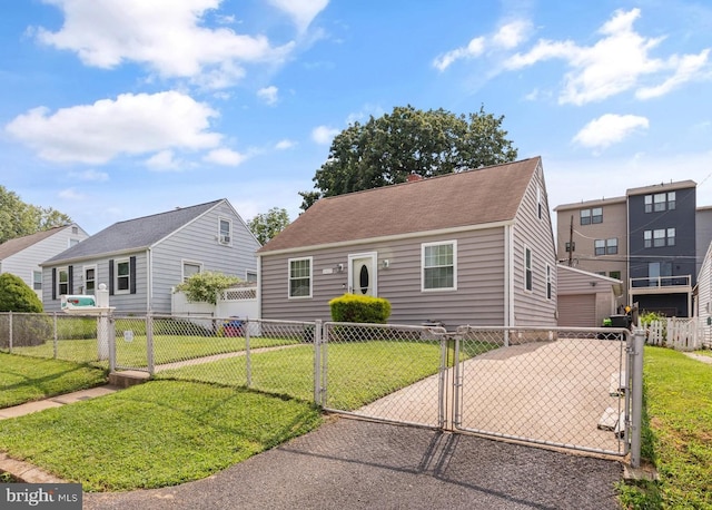 view of front of house with a garage, fence, a front yard, and a gate