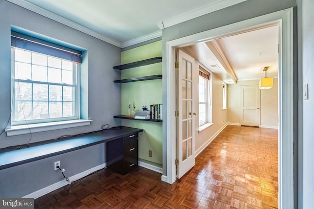 office featuring baseboards, plenty of natural light, and crown molding