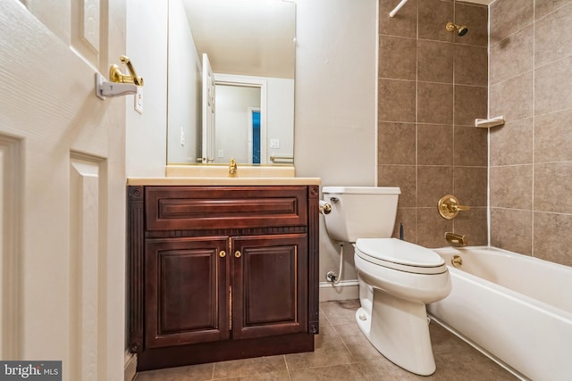 full bathroom with vanity, toilet,  shower combination, and tile patterned flooring