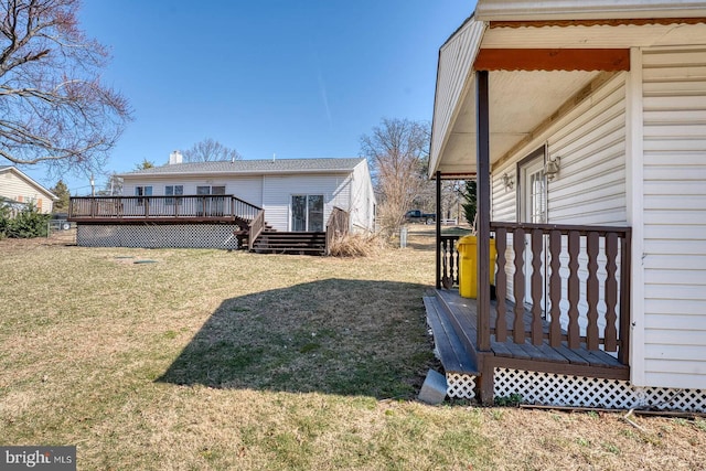 view of yard featuring a wooden deck