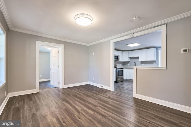 unfurnished living room with a sink, baseboards, dark wood-style floors, and crown molding