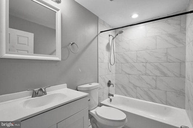 full bath with vanity, shower / tub combination, and toilet