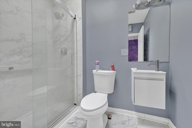 full bath featuring vanity, baseboards, a stall shower, toilet, and marble finish floor