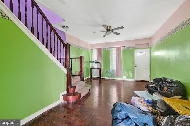 entrance foyer with stairway, baseboards, a ceiling fan, and hardwood / wood-style floors