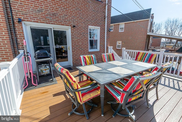 deck featuring outdoor dining area