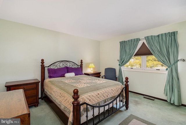 bedroom featuring carpet, visible vents, and baseboards