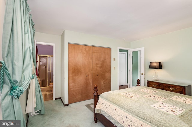 bedroom with a closet and light carpet