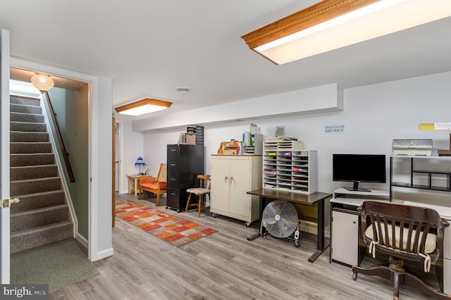 office featuring baseboards and wood finished floors