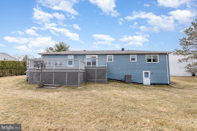 rear view of house featuring central air condition unit, a lawn, and a deck