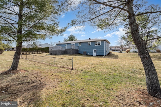 view of yard featuring fence and a wooden deck