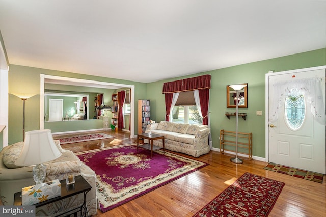 living room featuring wood finished floors and baseboards