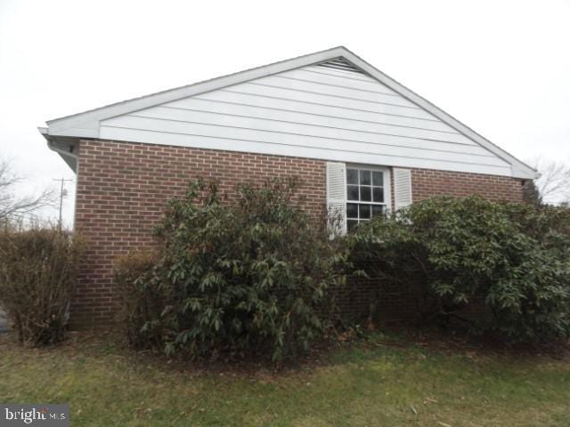 view of home's exterior featuring brick siding