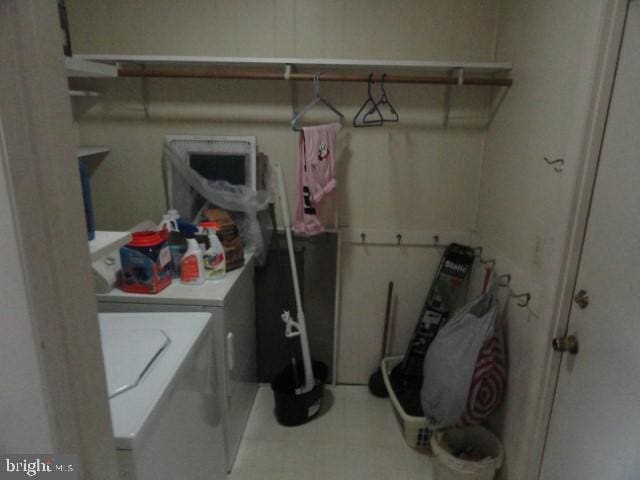 clothes washing area with washer and dryer and laundry area