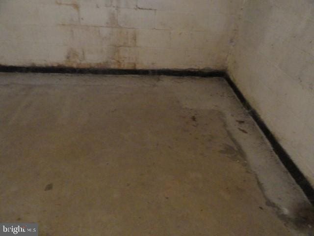 basement with concrete block wall