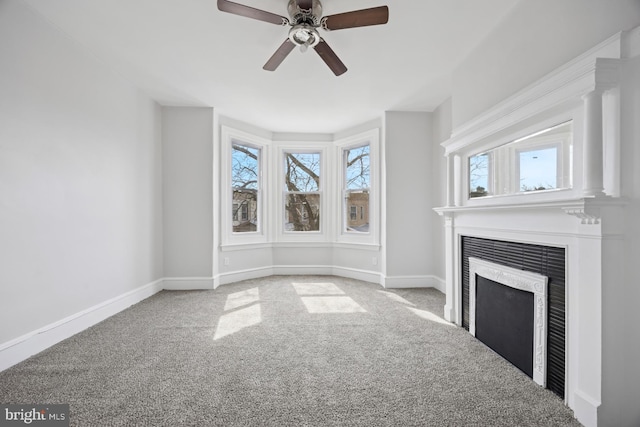 unfurnished living room featuring baseboards, carpet, and a fireplace