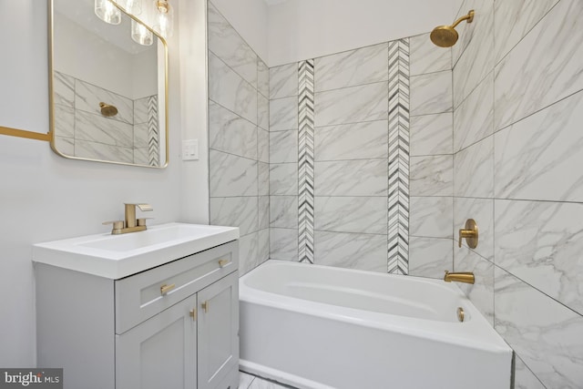 full bathroom featuring washtub / shower combination and vanity