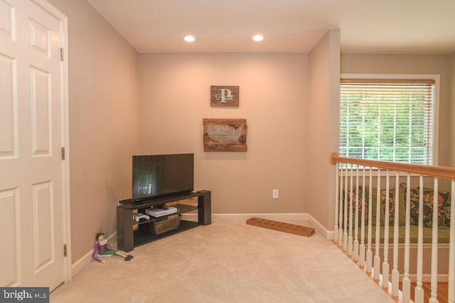 living area featuring recessed lighting, baseboards, and carpet floors