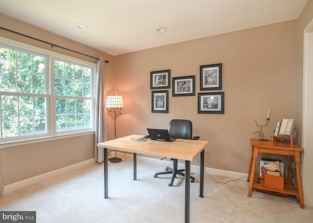 office area with recessed lighting, light colored carpet, and baseboards