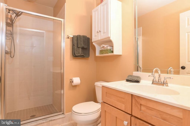 full bathroom with vanity, toilet, and a shower stall