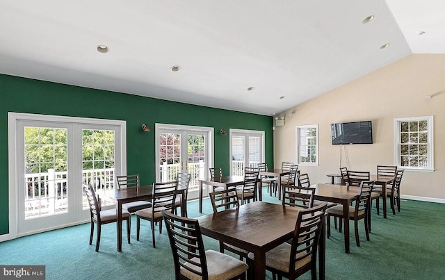 carpeted dining room featuring recessed lighting, french doors, lofted ceiling, and baseboards