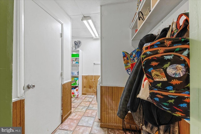 spacious closet with stone finish flooring