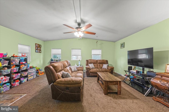 carpeted living area with a ceiling fan and vaulted ceiling