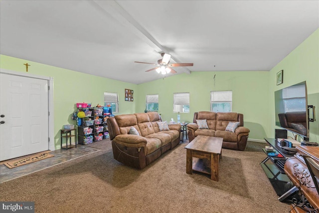 living area featuring vaulted ceiling with beams, baseboards, carpet floors, and ceiling fan