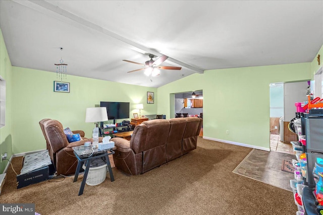 carpeted living room featuring lofted ceiling with beams, baseboards, and ceiling fan