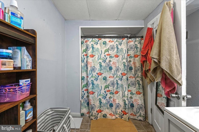 bathroom featuring curtained shower and tile patterned floors