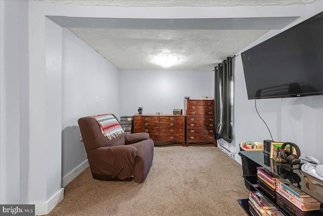 sitting room with carpet flooring and baseboards