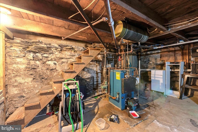 unfinished basement with a heating unit