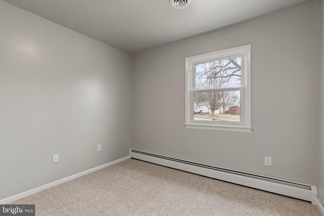 carpeted empty room with a baseboard radiator, baseboards, and visible vents