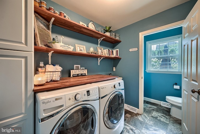 laundry area featuring laundry area, baseboards, independent washer and dryer, and visible vents